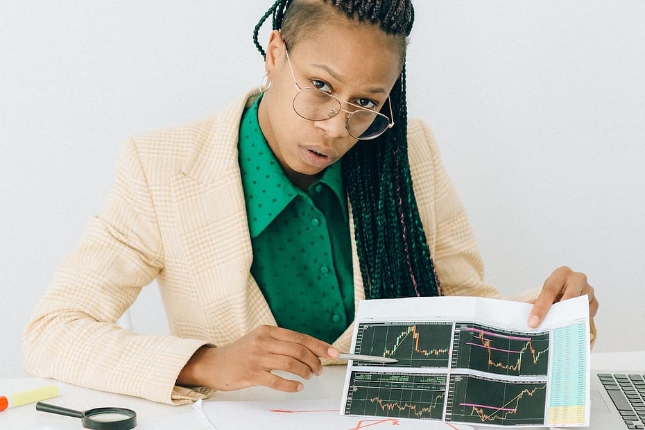 an adult holding a graph - facility management consultancy